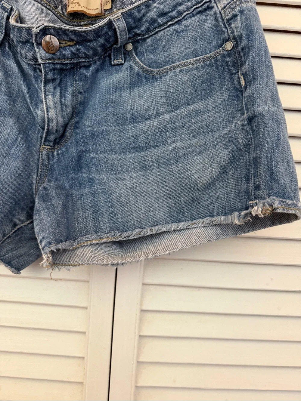 Paige Premium Denim Light Blue Distressed Denim Cutoff Shorts